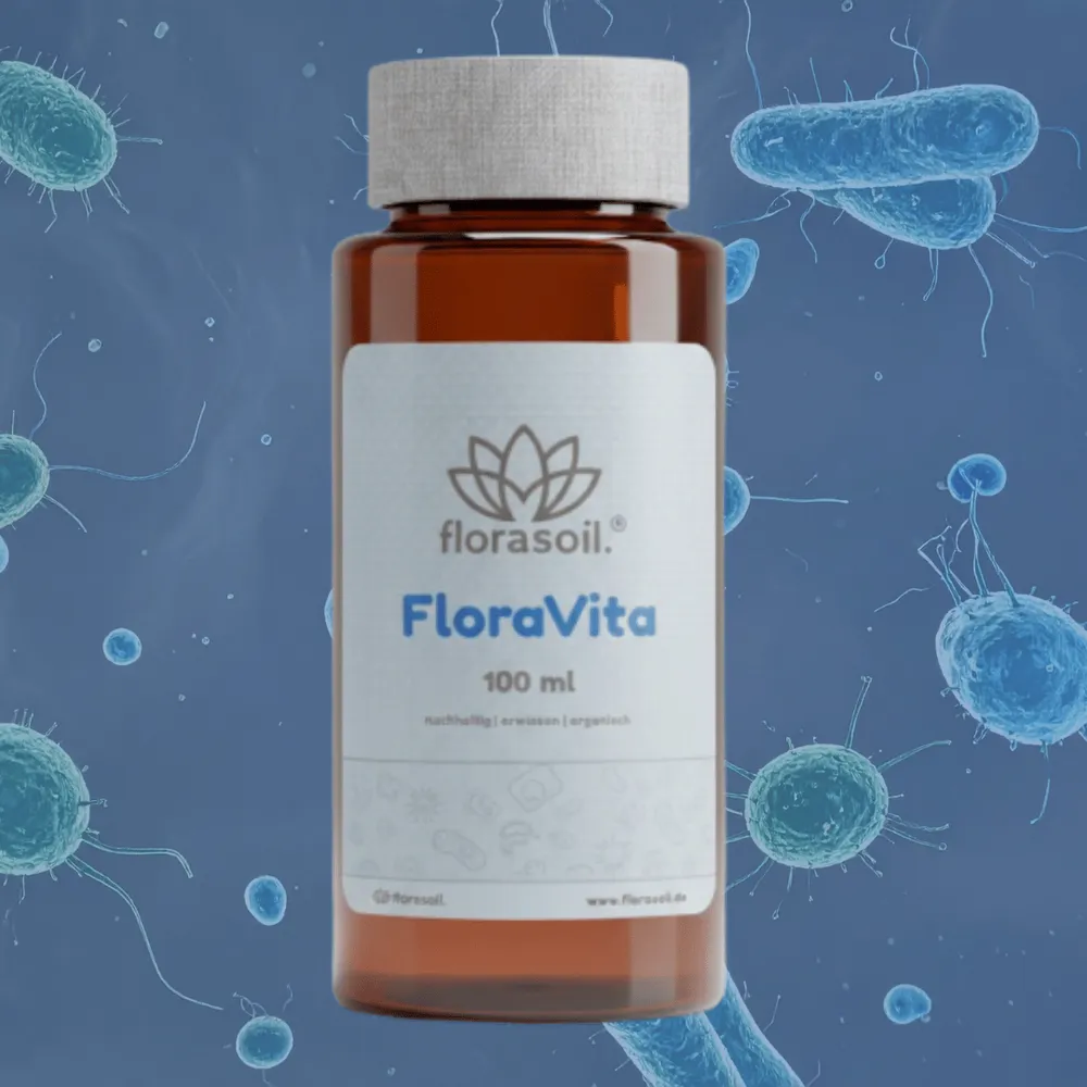 FloraVita Flasche vor blauem Hintergrund mit Darstellung von Mikroorganismen